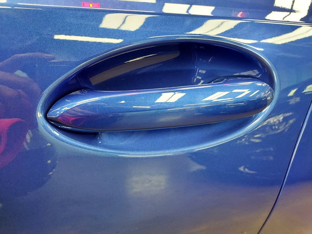 Front three-quarter view of the BMW 318 after coating.