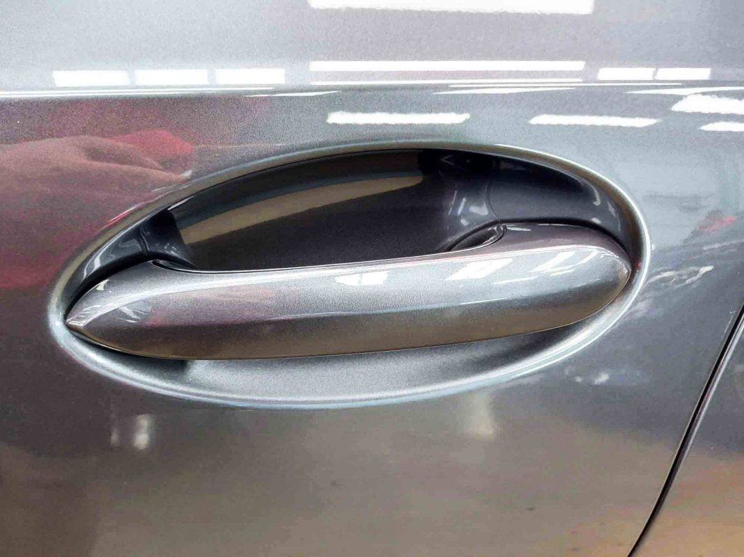 Front three-quarter view of the BMW 318i after coating.