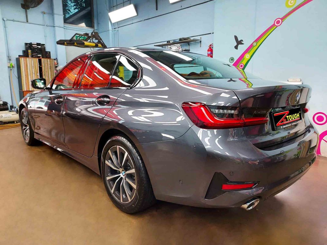 Rear quarter of the BMW 318i, glossy and protected.