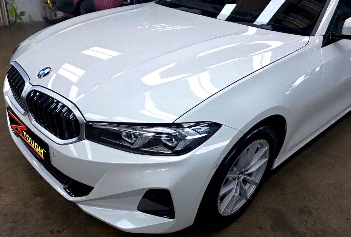 The BMW 318i from a side angle after the titanium coating.