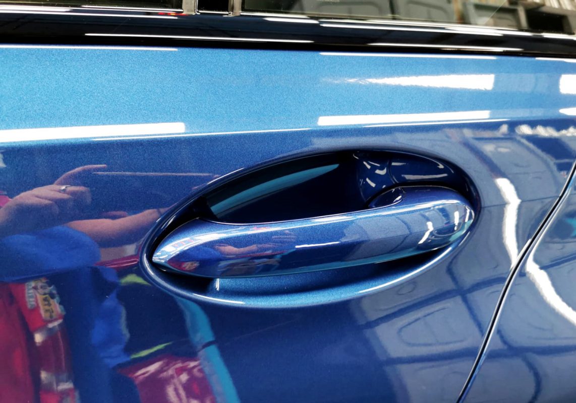 Front three-quarter view of the BMW 318i after coating.