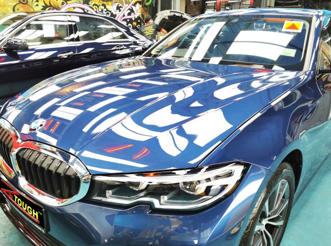 The BMW 318i from a side angle after the titanium coating.