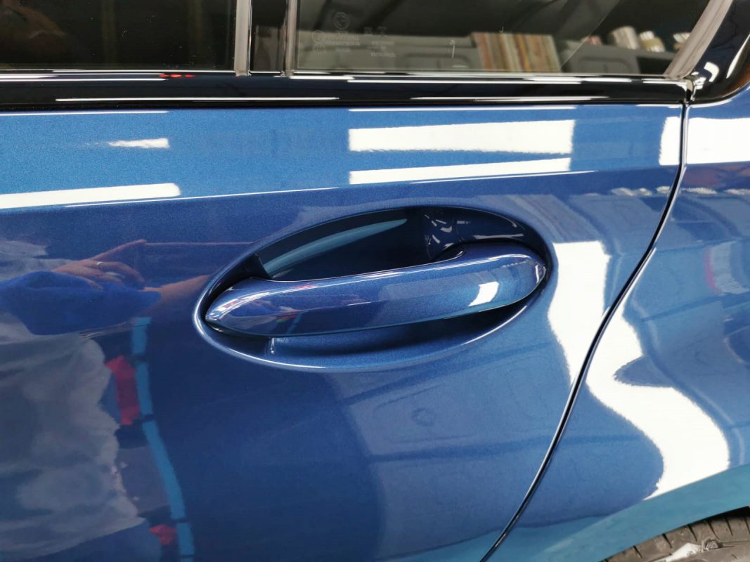 Front three-quarter view of the BMW 318i after coating.