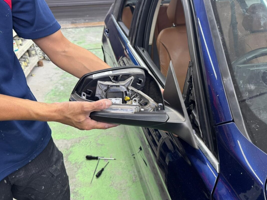 Compound polishing the new paint on the BMW 318i to bring up the shine.