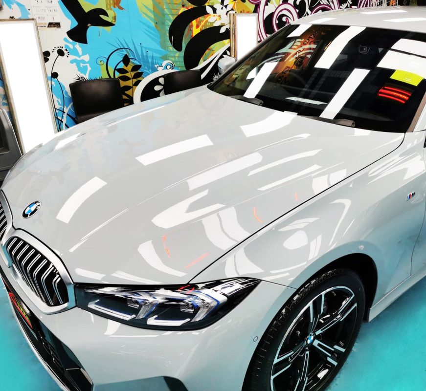 The BMW 318i from a side angle after the ceramic coating.