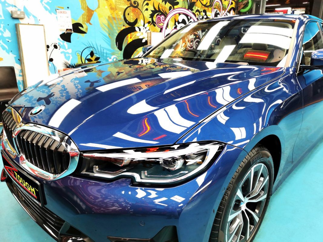 The BMW 318i from a side angle after the titanium coating.