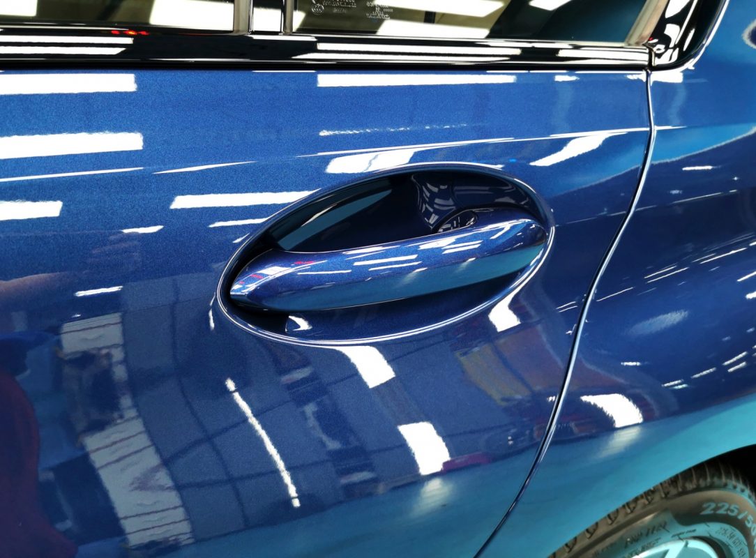 Front three-quarter view of the BMW 318i after coating.
