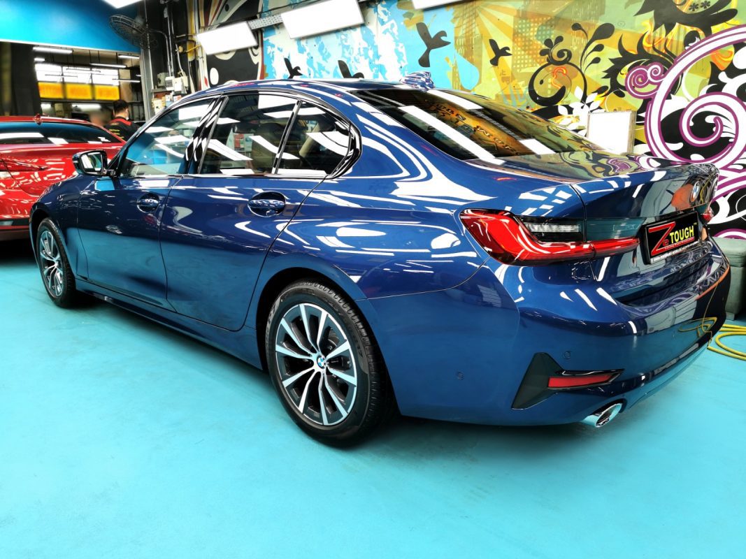 Rear quarter of the BMW 318i, glossy and protected.