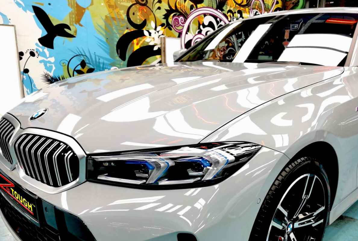 The BMW 318i from a side angle after the ceramic coating.