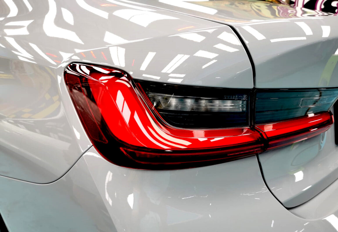 Rear quarter of the BMW 318i, glossy and protected.