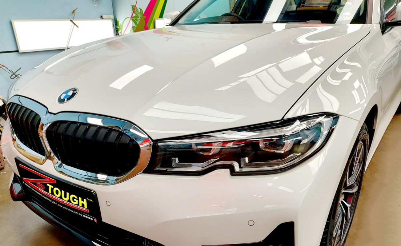 The BMW 318i from a side angle after the ceramic coating.