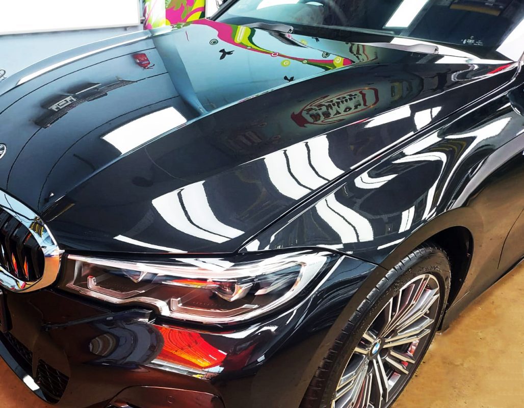 The BMW 318i from a side angle after the titanium coating.