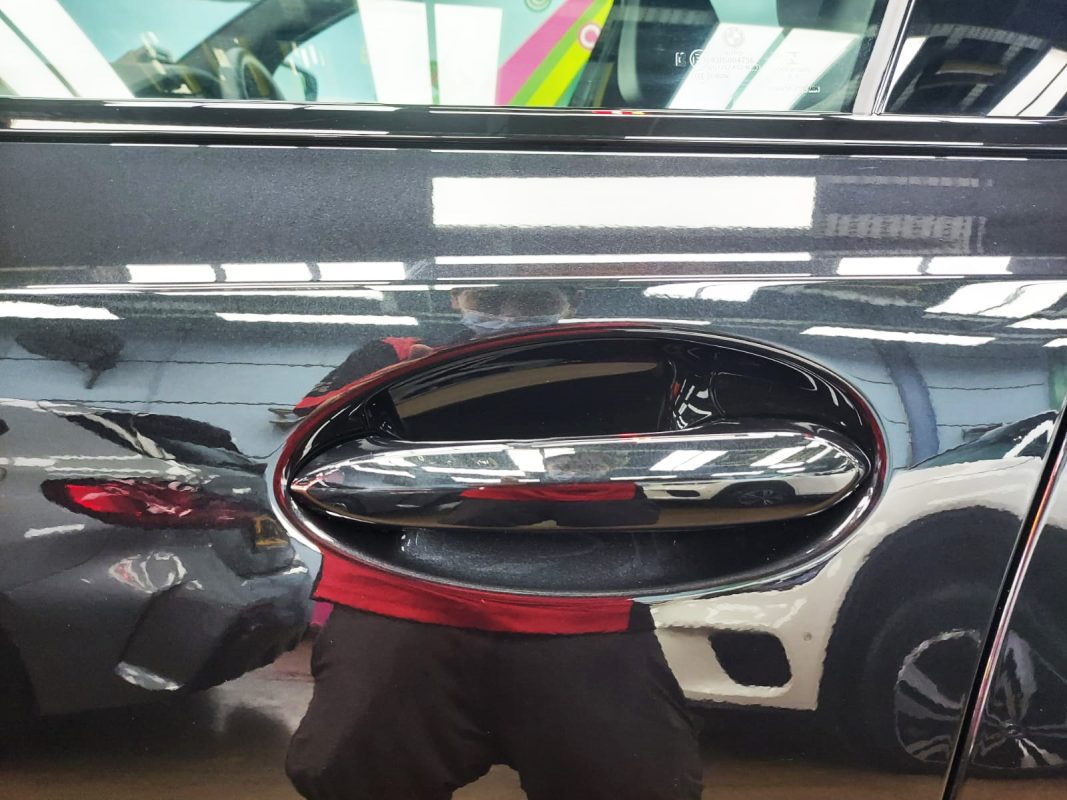 Front three-quarter view of the BMW 318i after coating.