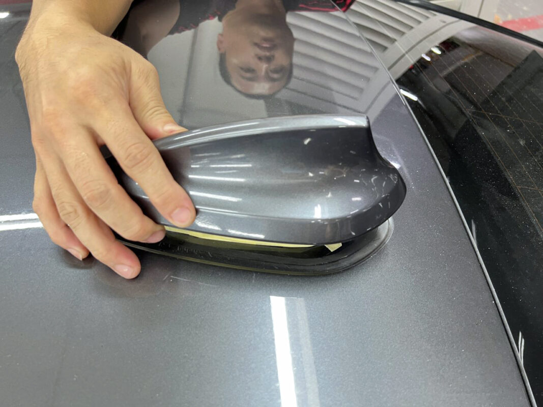 Panels off the BMW 320i during strip-down, exposing the bare bodywork.