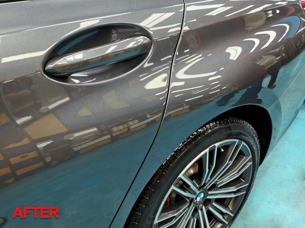 Close-up of the BMW 320i's finished bodywork, smooth and evenly coated.