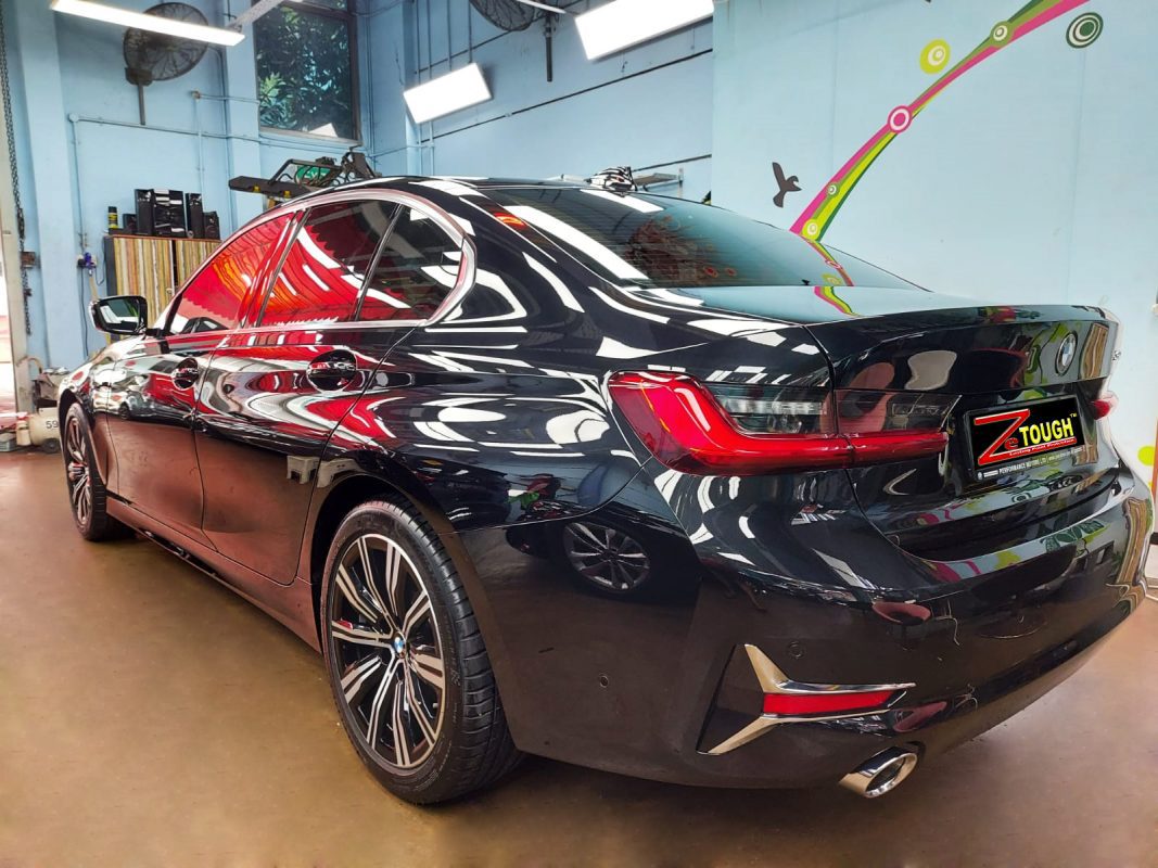 Front three-quarter view of the BMW 320i after coating.