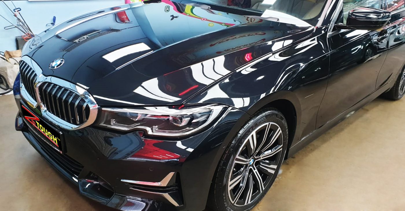 The BMW 320i from a side angle after the ceramic coating.