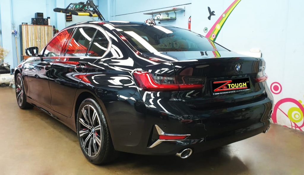 Front three-quarter view of the BMW 320i after coating.