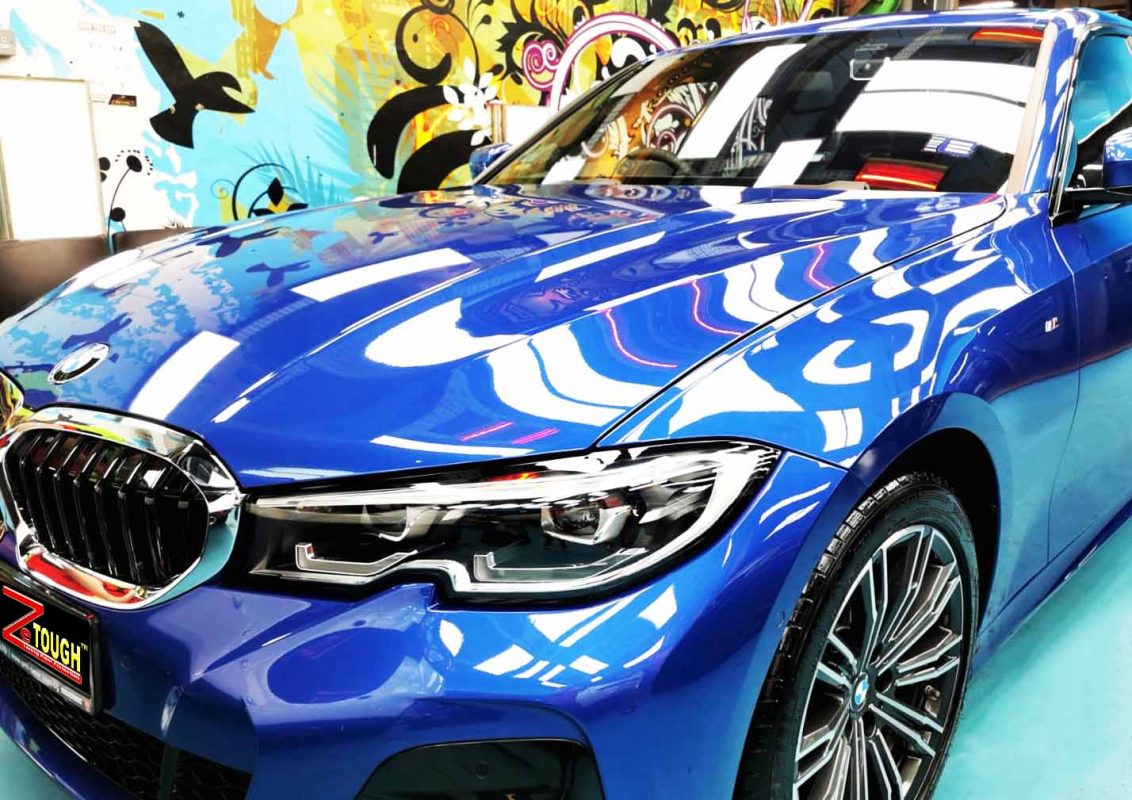 The BMW 320i from a side angle after the titanium coating.