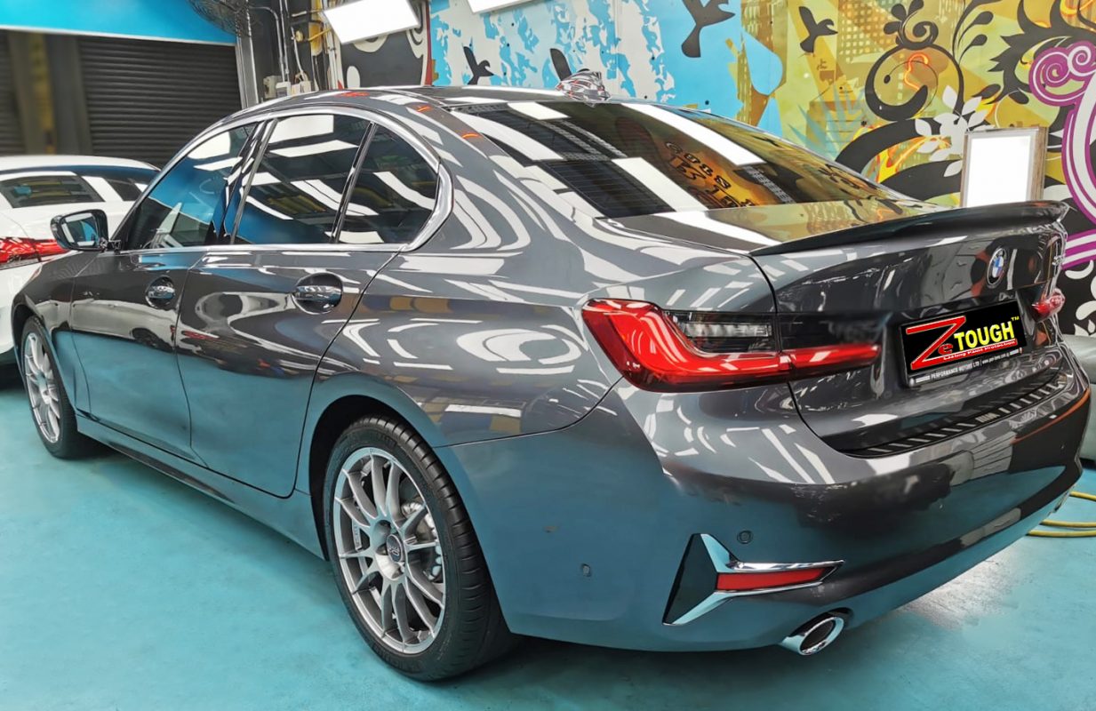 Rear quarter of the BMW 330i, glossy and protected.