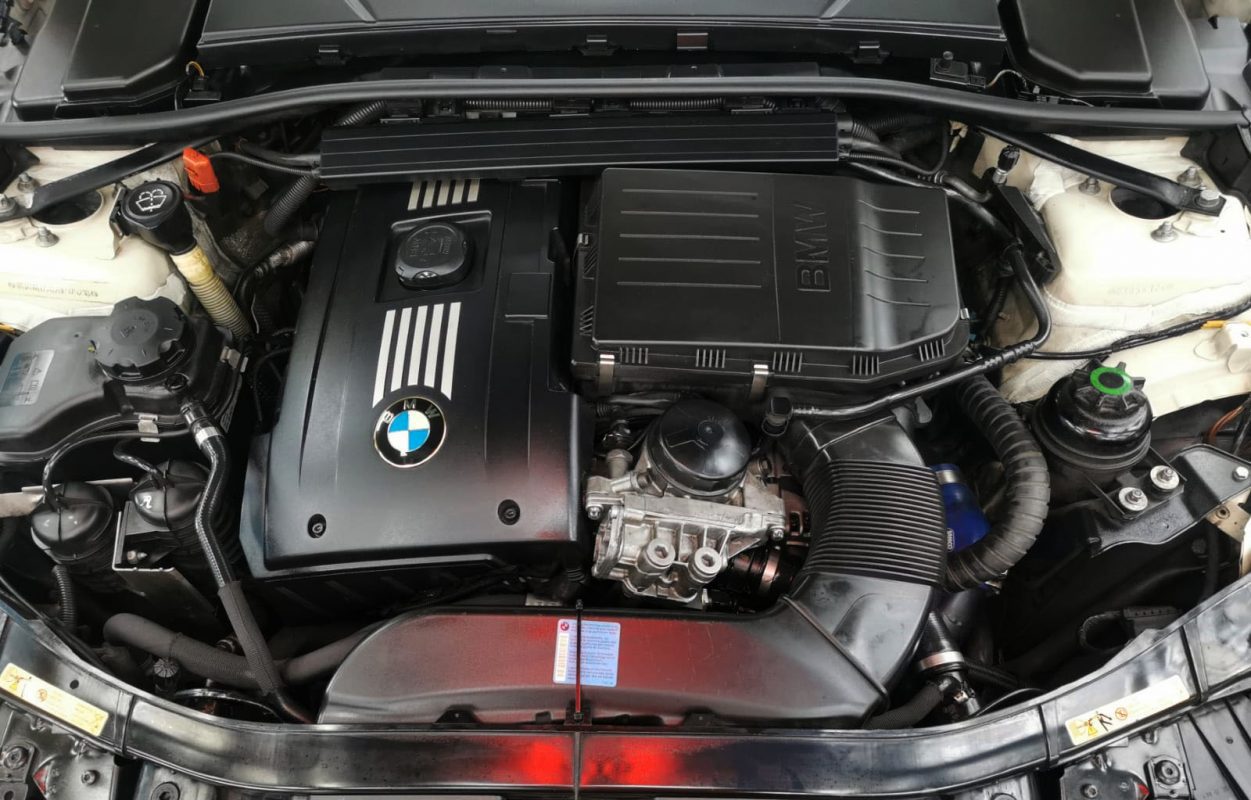 The 335i's coated paintwork holding clean reflections.