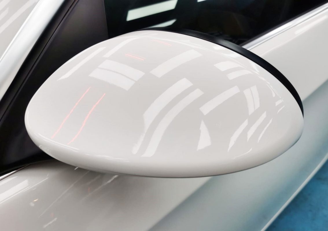 Rear quarter of the BMW 335i, glossy and protected.