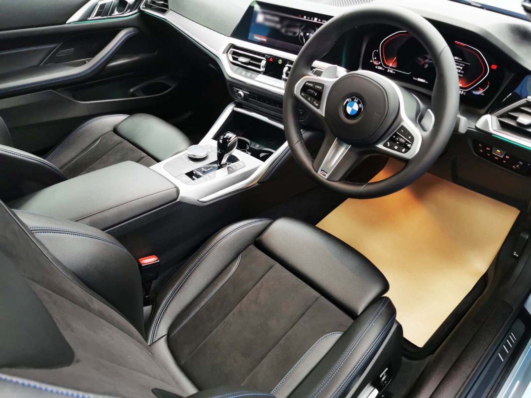 The BMW 4 Series parked in the workshop, freshly coated.