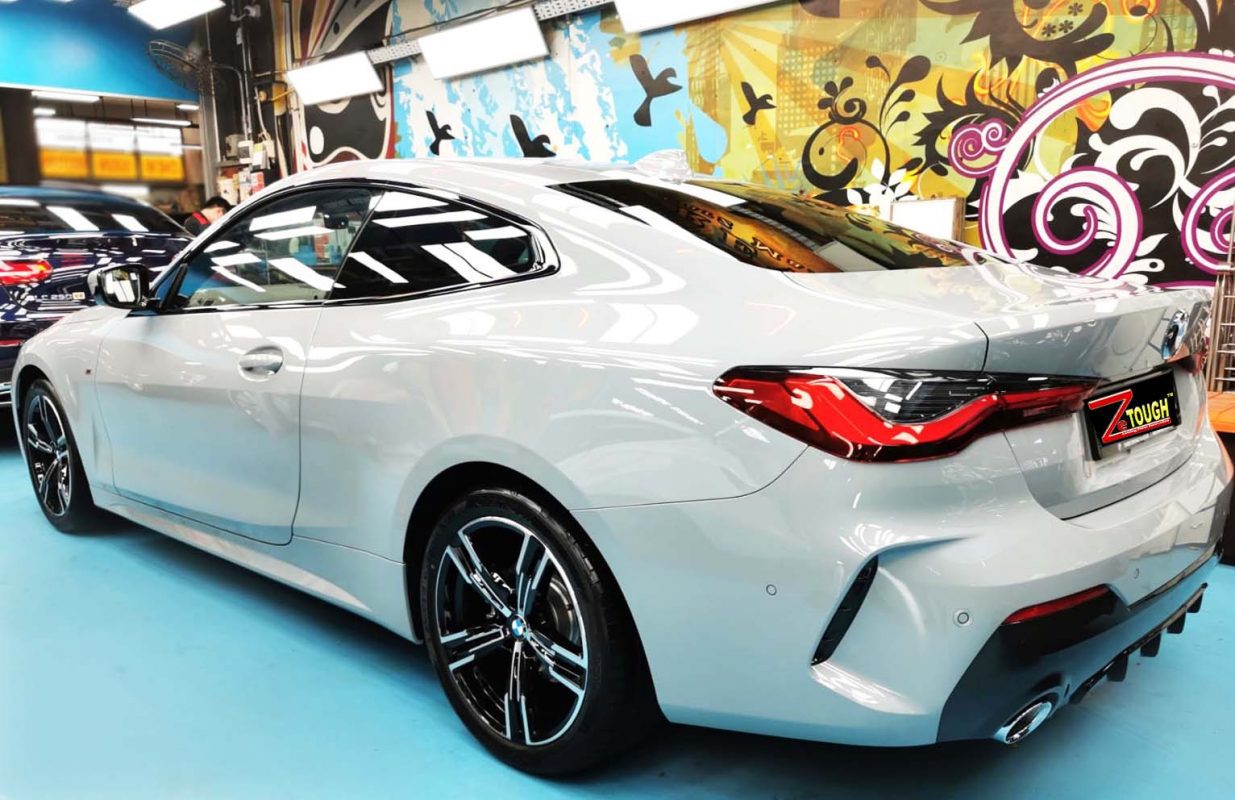 Rear quarter of the BMW 4 Series, glossy and protected.