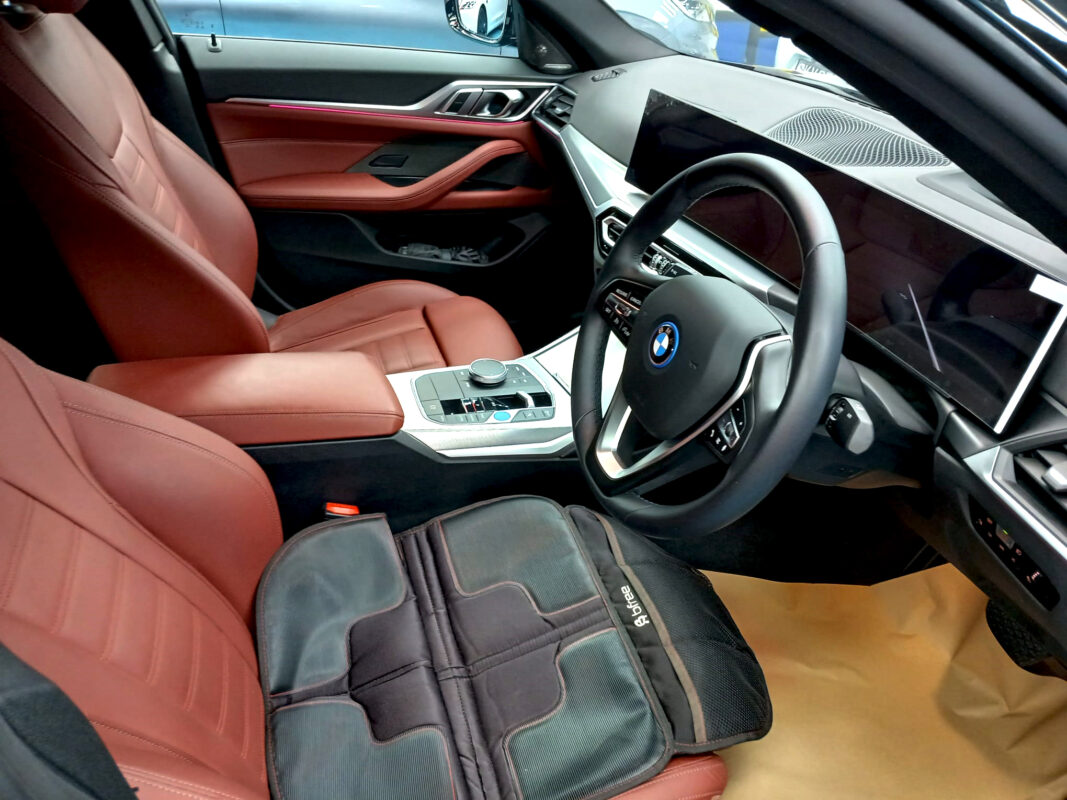 The BMW 4 Series parked in the workshop, freshly coated.