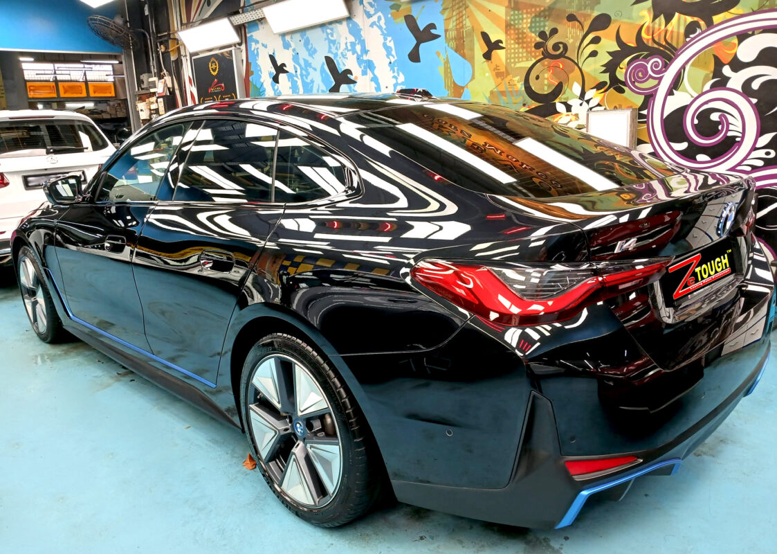 Rear quarter of the BMW 4 Series, glossy and protected.