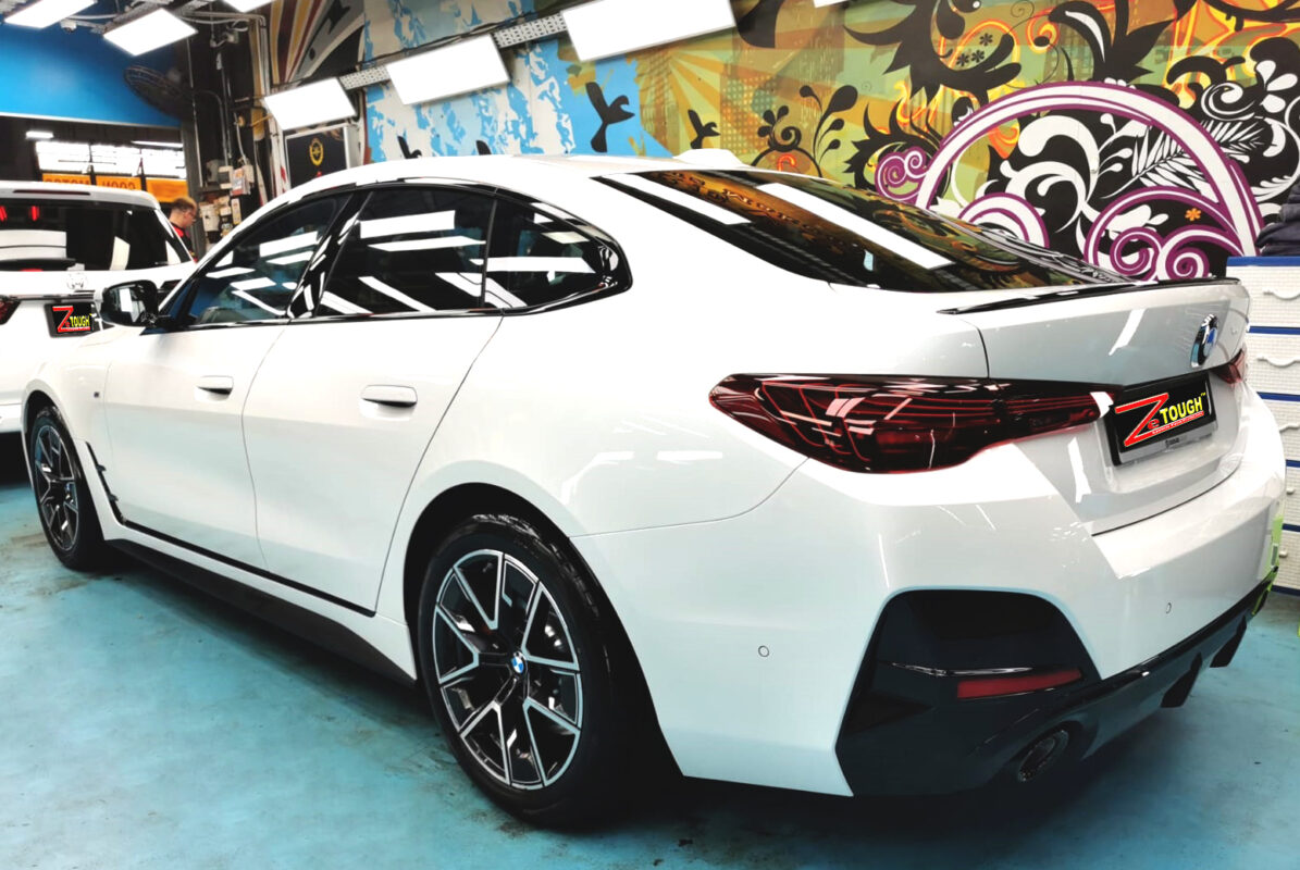 Rear quarter of the BMW 4 Series, glossy and protected.