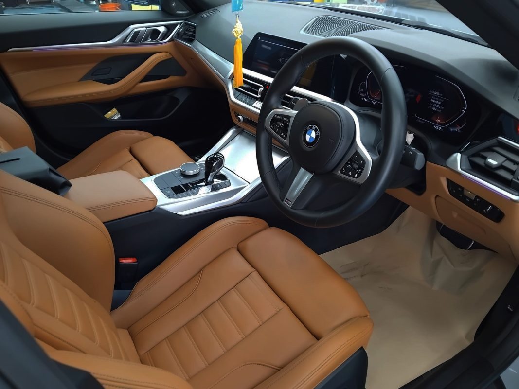 The BMW 4 Series parked in the workshop, freshly coated.