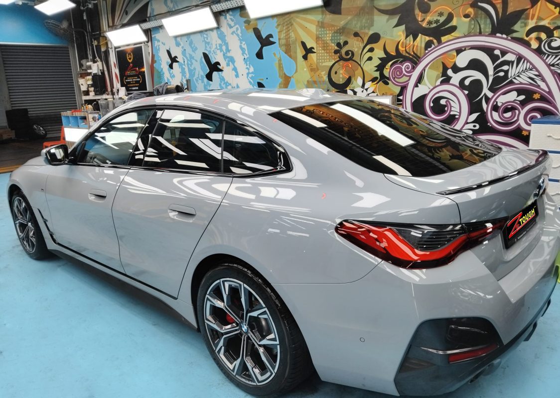 Rear quarter of the BMW 4 Series, glossy and protected.