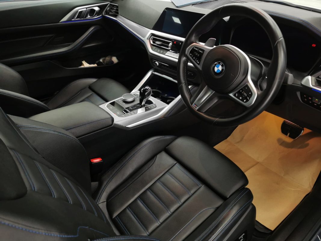 The BMW 4 Series parked in the workshop, freshly coated.