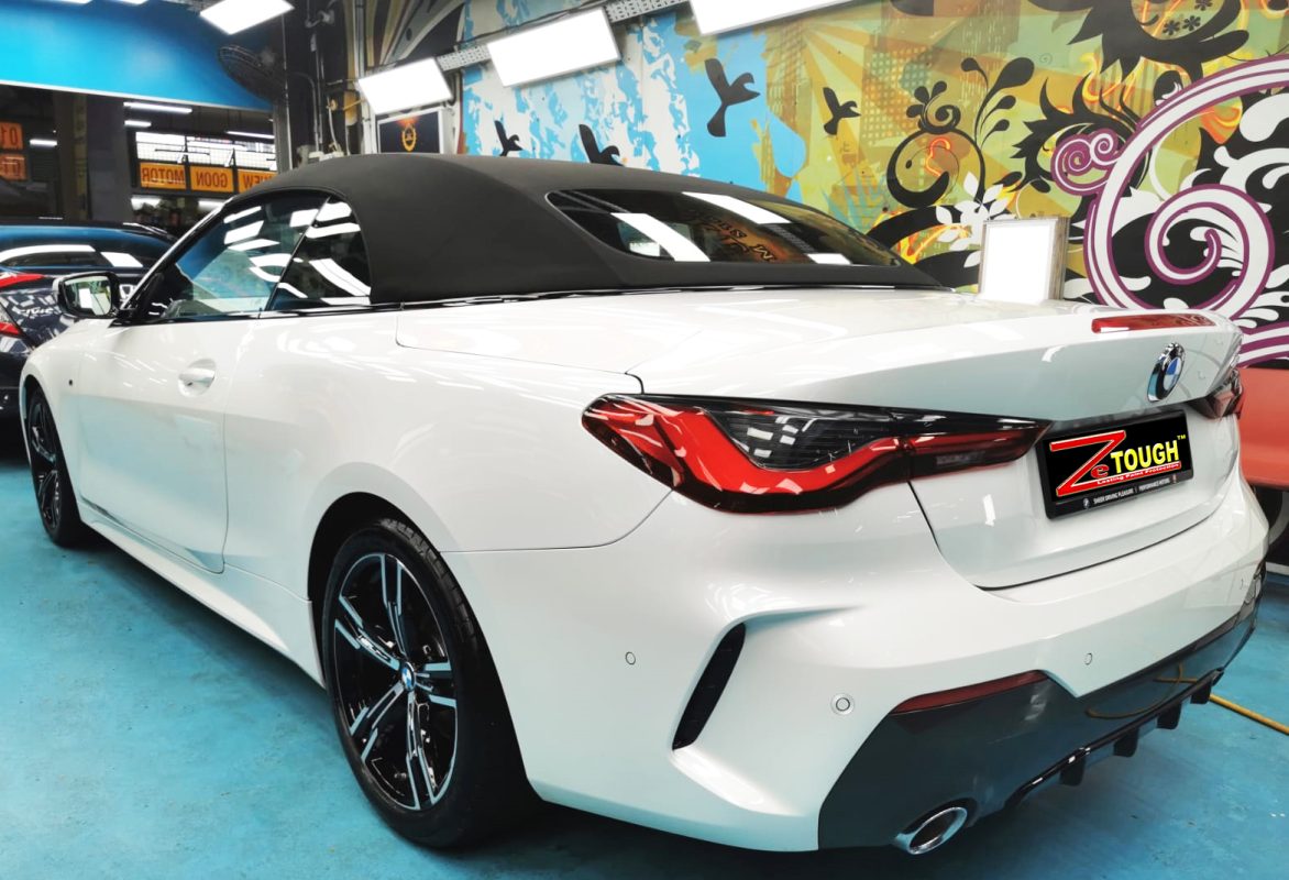 Rear quarter of the BMW 4 Series, glossy and protected.