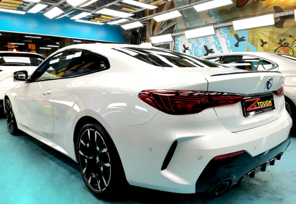 Rear quarter of the BMW 4 Series, glossy and protected.