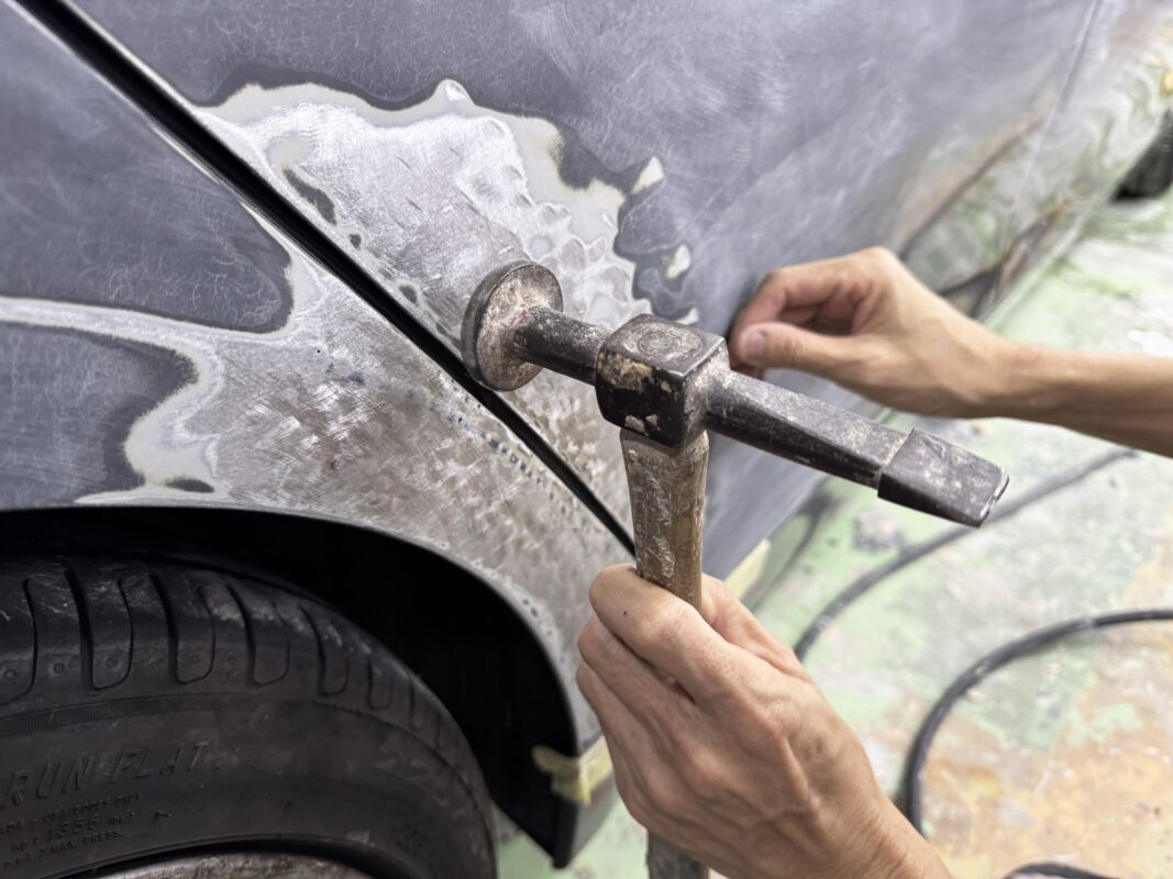 The body surface being examined for paintwork imperfections.
