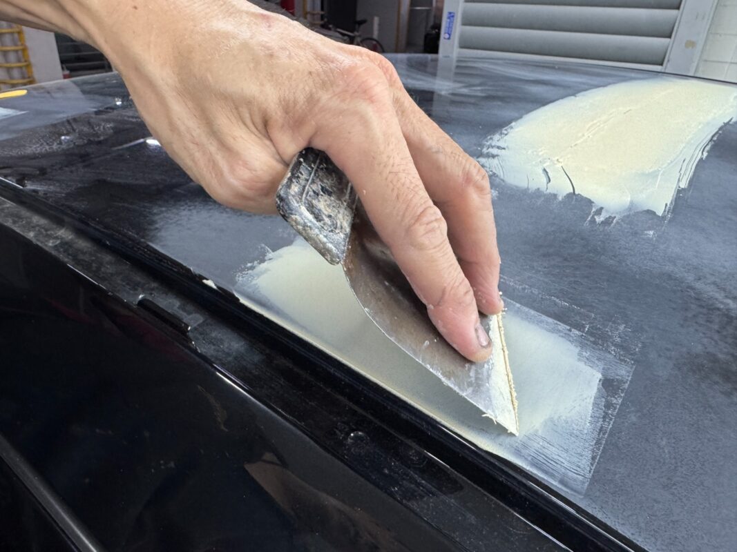 Paintwork flaws being repaired and patched on the BMW 4 Series.