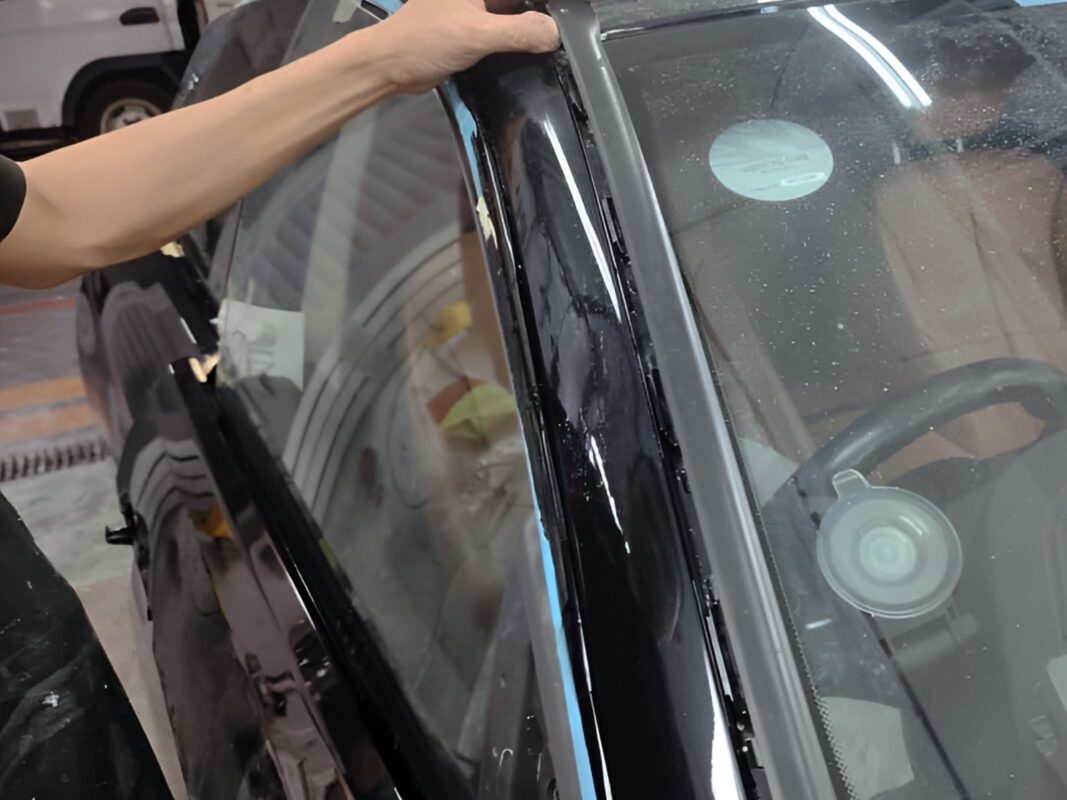 Previously removed car parts being refitted onto the BMW 4 Series.