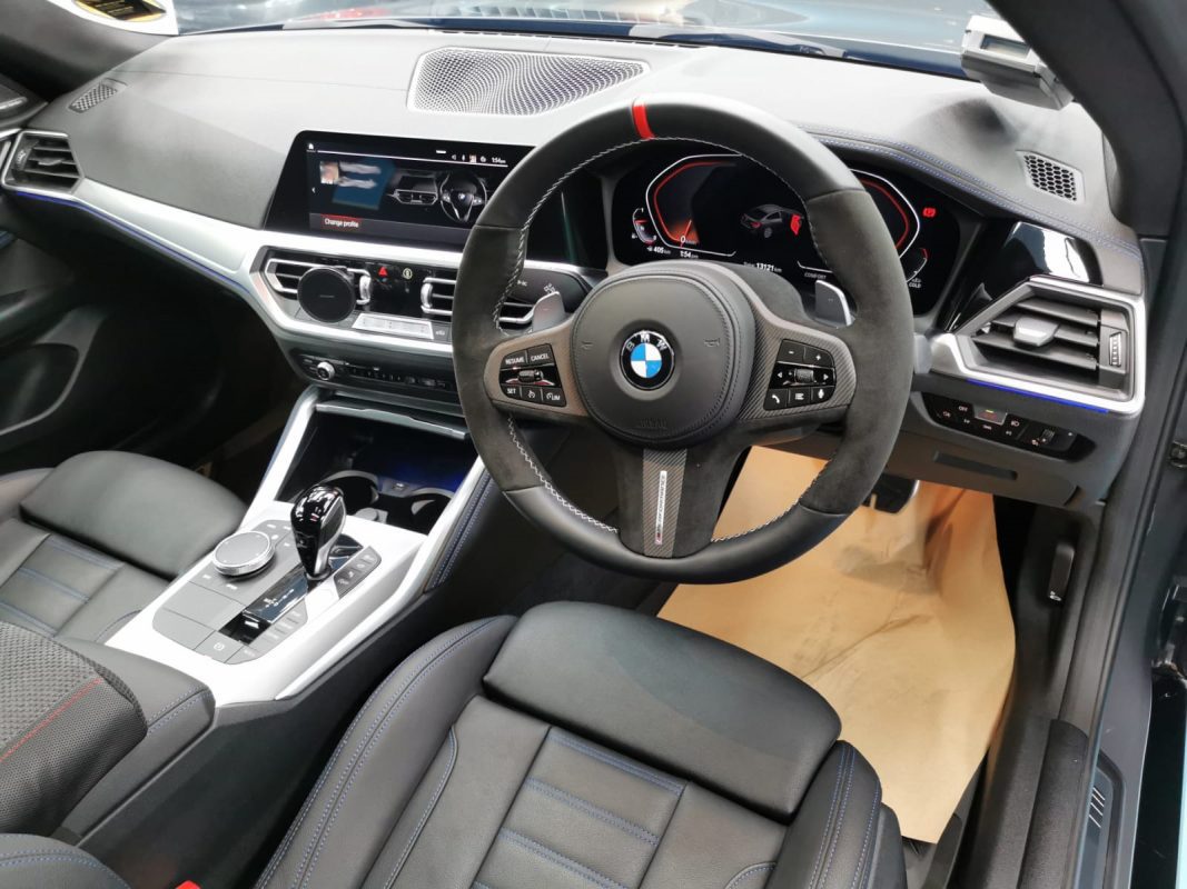 The BMW 4 Series parked in the workshop, freshly coated.