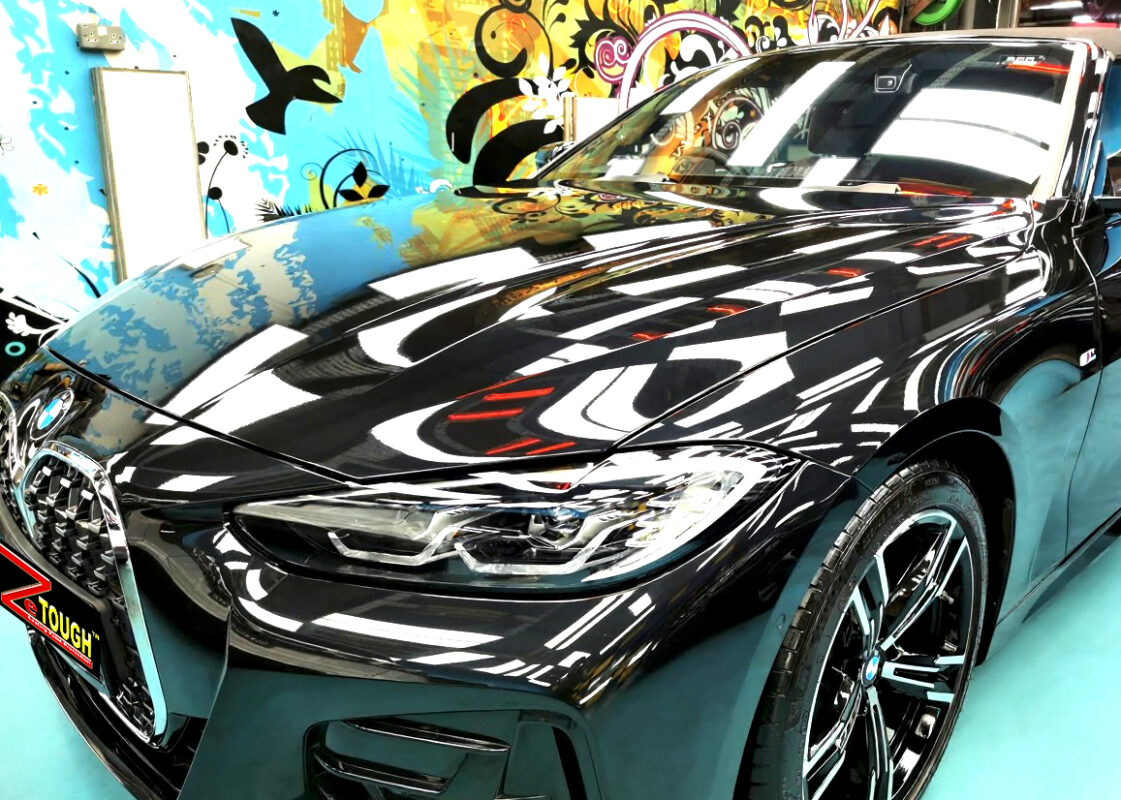 The BMW 4 Series's coated paintwork under workshop lighting.