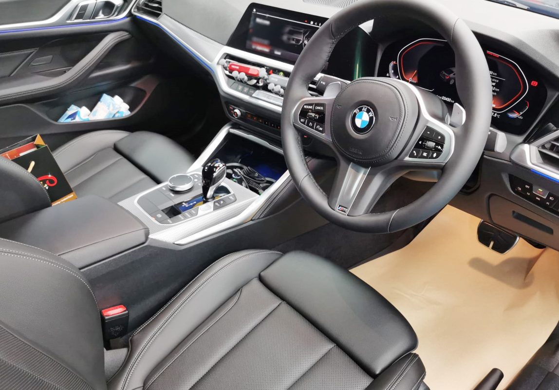 The BMW 4 Series parked in the workshop, freshly coated.