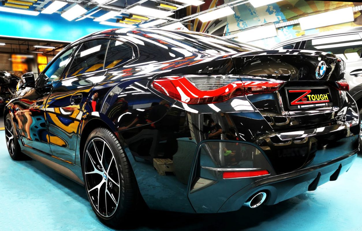 Rear quarter of the BMW 4 Series, glossy and protected.