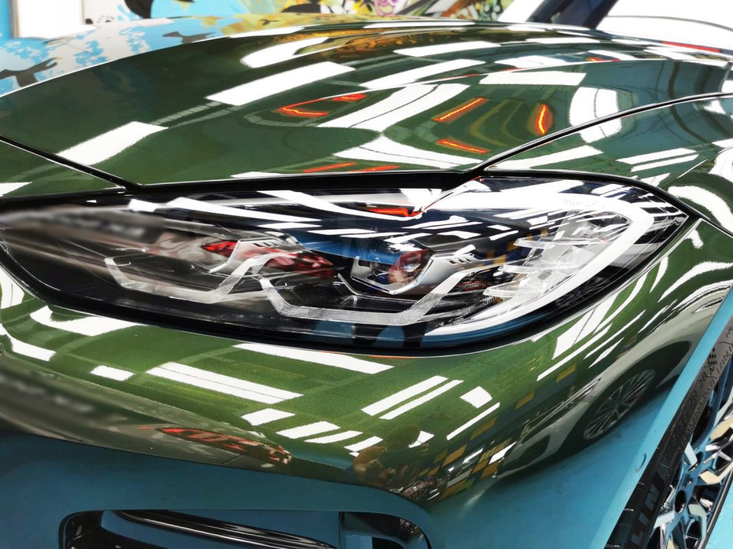 The 420i's coated paintwork showing clean reflections.