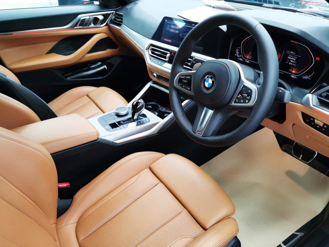 The BMW 420i parked in the workshop, freshly coated.