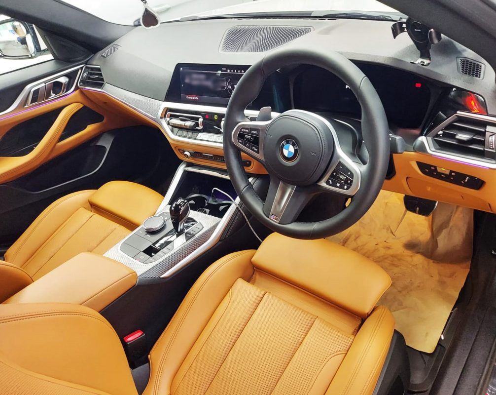 The BMW 420i parked in the workshop, freshly coated.