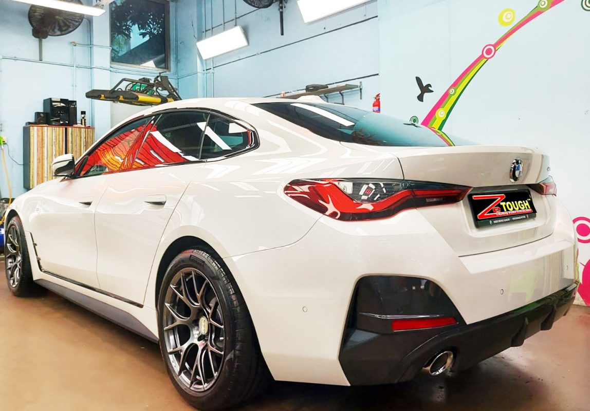 Rear quarter of the BMW 420i, glossy and protected.