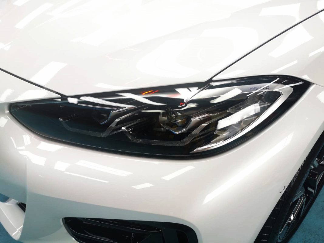 The 420i's coated paintwork showing clean reflections.
