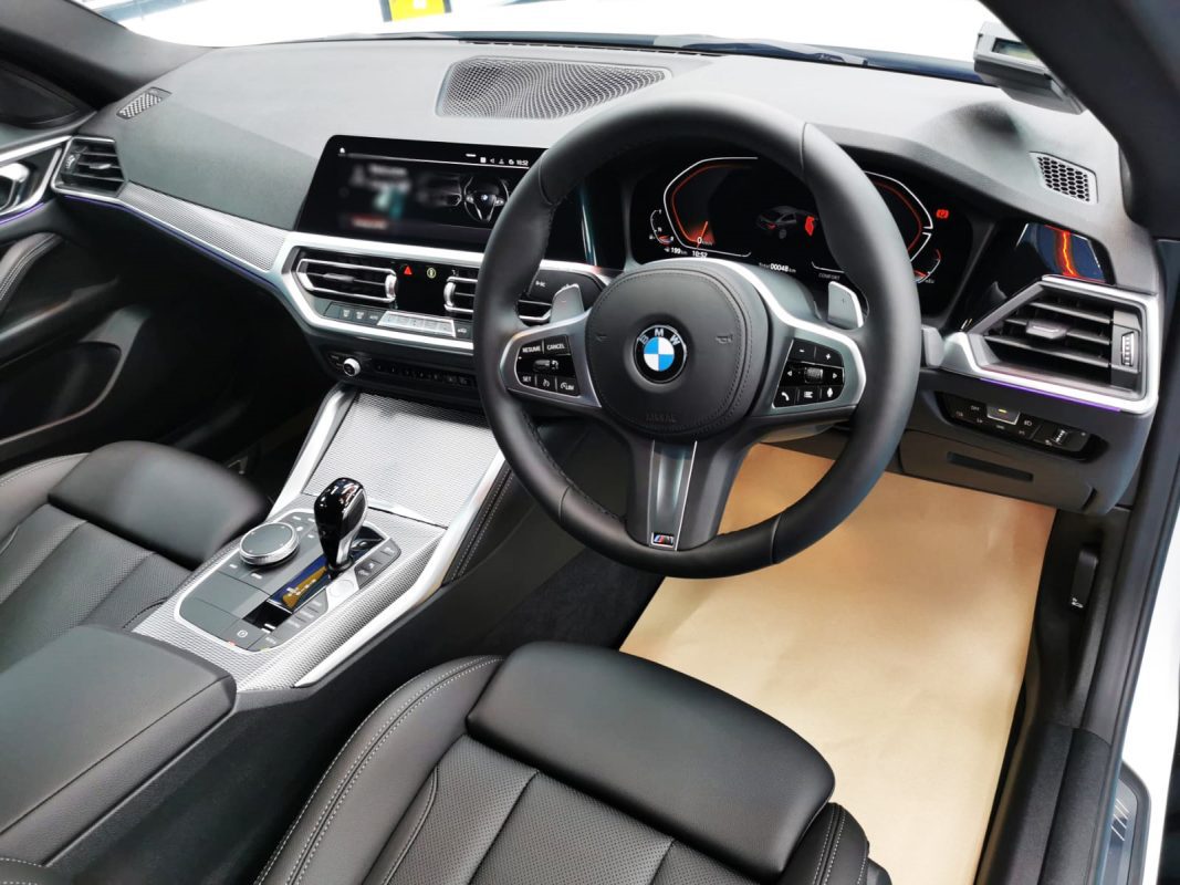 The BMW 420i parked in the workshop, freshly coated.