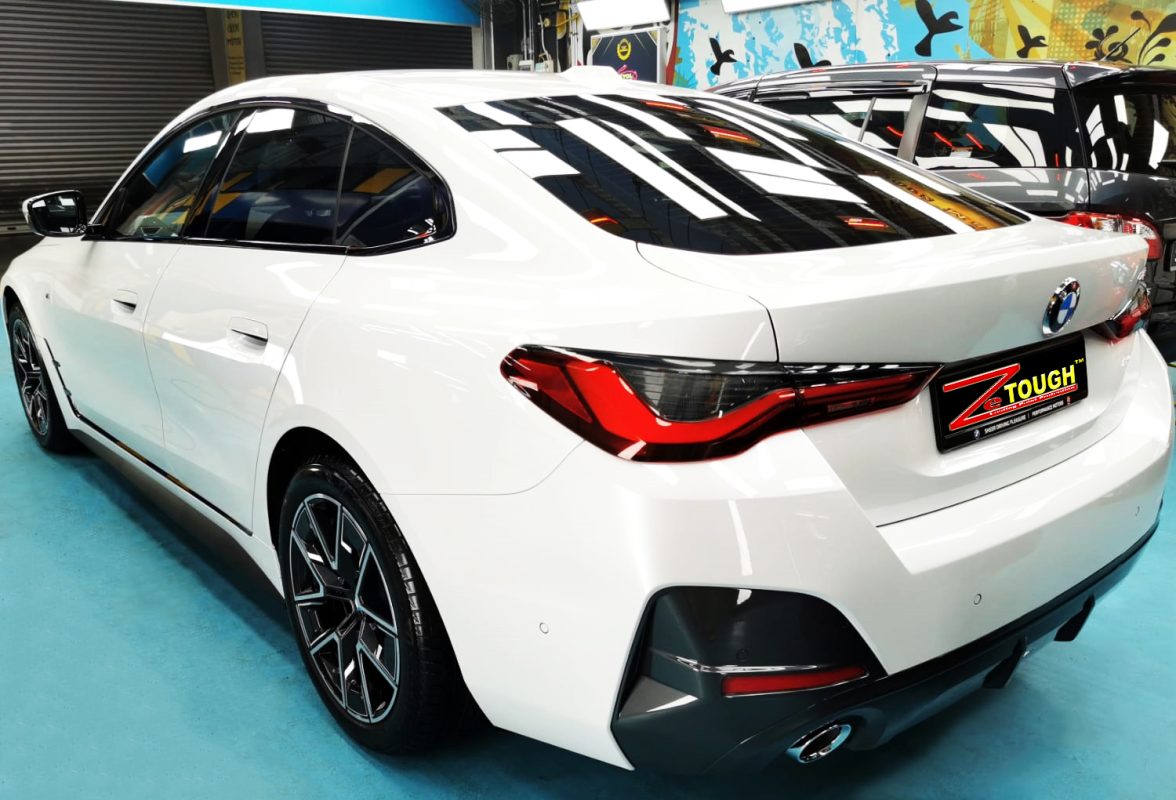 Rear quarter of the BMW 420i, glossy and protected.